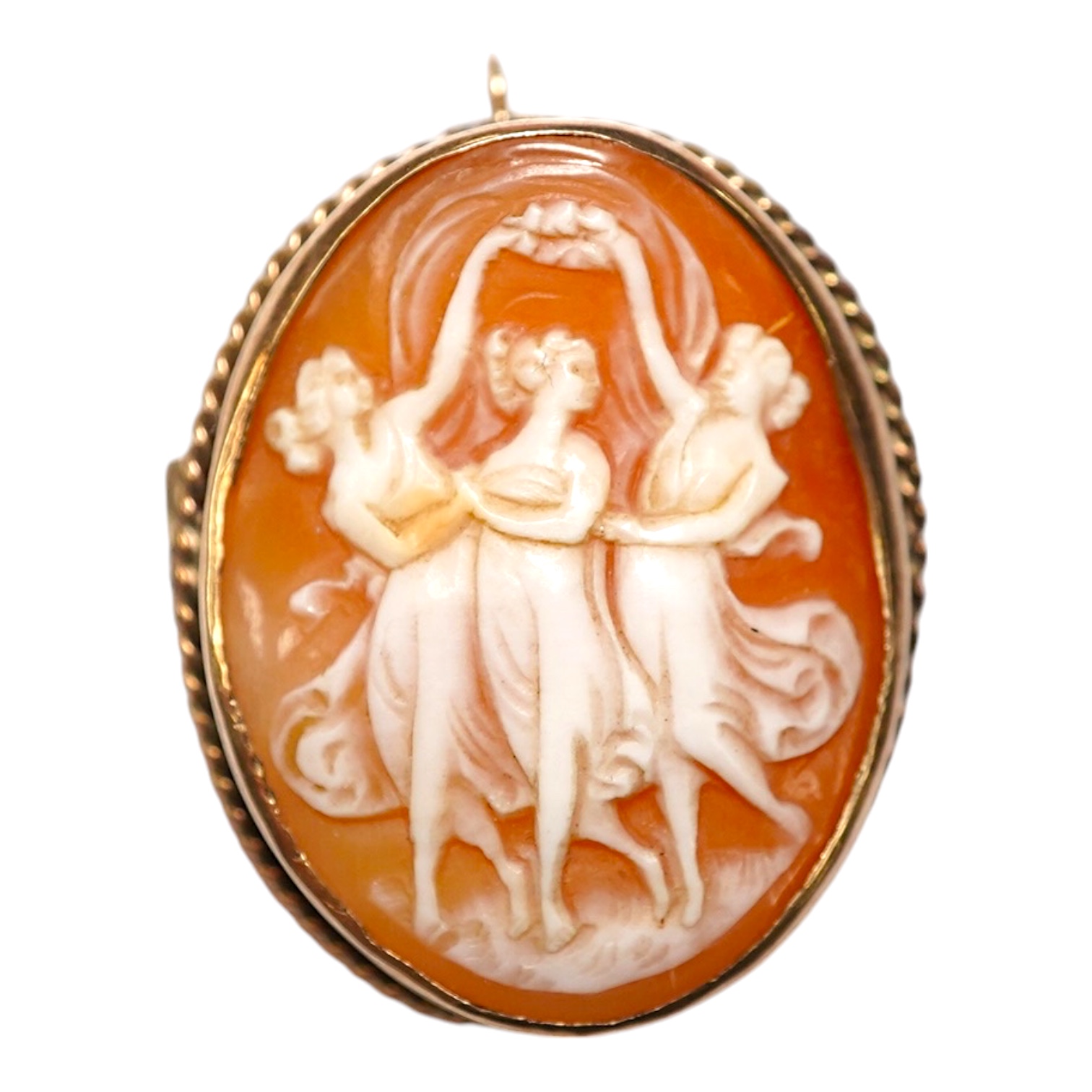 A yellow metal mounted oval cameo shell brooch, carved with The Three Graces, 30mm, gross weight 8 grams. Condition - fair